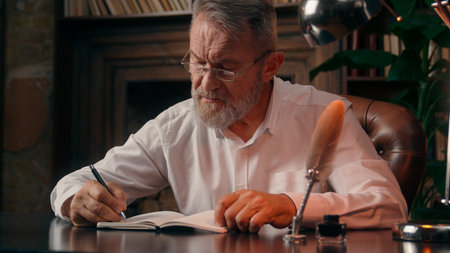 Confident successful old Caucasian man male mature takes off glasses looking at camera folded hands home office business businessman entrepreneur worker inside handsome elder employee portrait leaderの写真素材