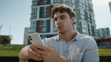 Caucasian man mobile phone smartphone error problem broken businessman male business guy disappointed stressed lost failure frustrated bad news cellphone outdoor gadget upset city internet low batteryの写真素材