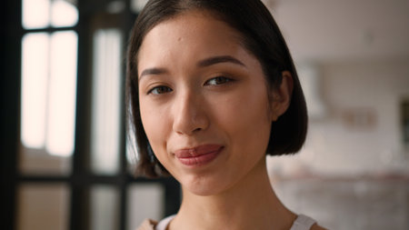 Happy Caucasian latina woman hispanic lady girl joyful cheerful positive emotion expression female wife home owner loan mortgage looking at camera laugh joy healthy toothy smile face beauty close upの写真素材