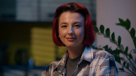 Happy woman looking at camera smiling portrait female girl at home evening indoors positive redhead...