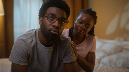 African American married family ethnic couple quarrel argument conflict guilty woman wife comforting...