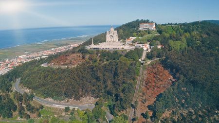 Sanctuary of Santa Luzia on hilltop in Viana do Castelo Portugal with Atlantic Ocean coastline city architecture forest sunlight scenic landscape horizon in summer day Aerial panoramic view travelingの写真素材