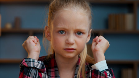 Portrait at home child kid girl little daughter in evening home looking at camera teen pupilの写真素材