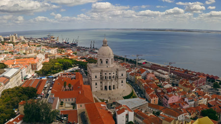 Aerial view Lisbon panoramic scene National Pantheon dome Tagus River waterfront harbor cranes aerial drone flying top of Portuguese capital blending historic architecture traveling trip travel tourの写真素材