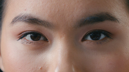 Close up woman sad dark eyes looking at camera girl upset female gaze long eyelashes good vision eyesight details human eye sight laser surgery ophthalmology medicineの写真素材