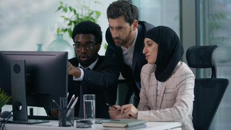 Multicultural business colleagues teamwork in office multiracial three co-workers working together...