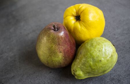 Still life with fruits on the grey table. Close up photo.の写真素材