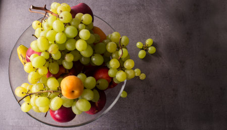 Still life with juicy summer fruits. Top view photo on dark background with copy space. Fresh...