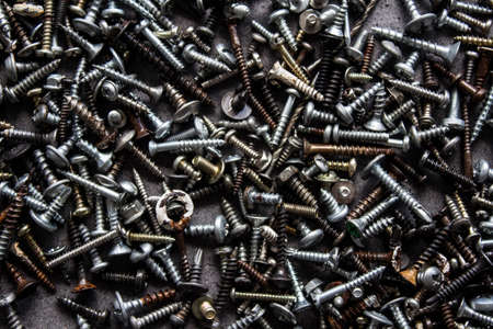 Old bolt and nuts close up photo. Abstract industrial background.の写真素材