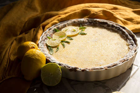 Lemon tart close up photo. Homemade sweet pie with citrus fruits. Healthy eating concept.Â の写真素材