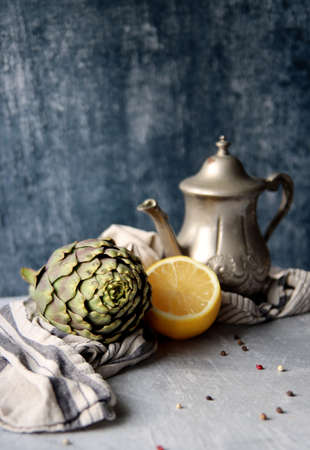 Still life with fresh organic artichokes. Eating healthy concept. Vegetarian meal p[reparation. Simple composition food still life.の写真素材