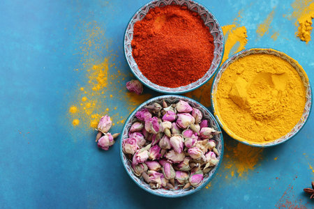 Colorful spices in bowls on color background, top view. Space for textの写真素材
