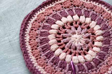Handmade crocheted from wool yarn. Handmade. Selective focus.