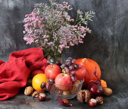 Autumn still life with fruits and vegetables on a dark background.の写真素材