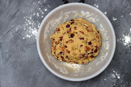 Bowl of oatmeal cookies with raisins and cranberriesの写真素材