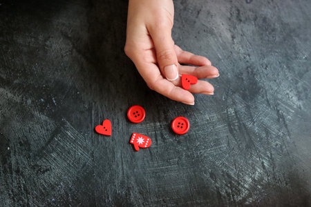 Woman's hand on a black background.の写真素材