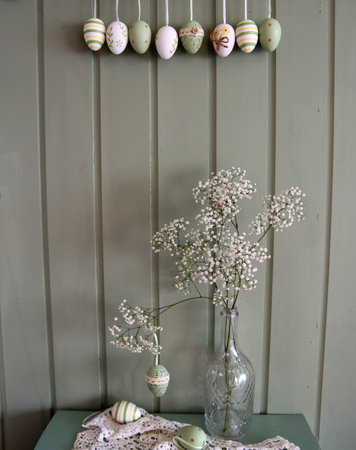 Easter decoration with eggs and gypsophila in vase