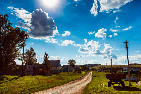 Beautiful view of rural summer landscape at fluffy clouds sunny sky background.の写真素材