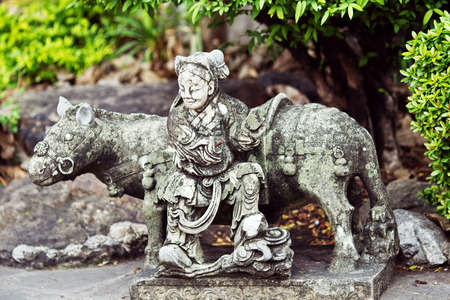 Stone statue of woman and horse in Thailandの写真素材