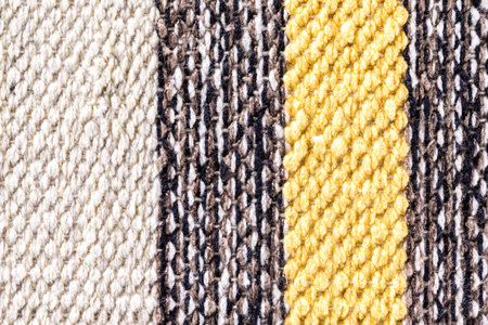 Closeup image of colorful Indian carpet as an abstract textile background.