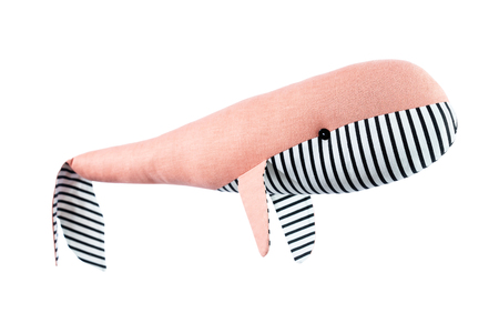 Closeup image of soft toy whale pillow with ornament isolated at white background.の写真素材