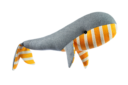 Closeup image of handmade toy whale pillow with ornament isolated at white background.の写真素材