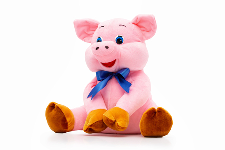 Pink soft toy pig bag for presents as a symbol of chinese new year isolated at white background.の写真素材