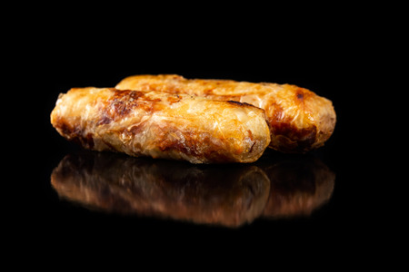 Macro image of traditional vietnamese food  - cha gio spring rolls isolated at black background.の写真素材