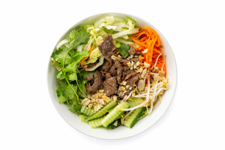 Closeup vietnamese healthy fresh salad of beef meat, bamboo, cabbage, cucumber and carrot served in...