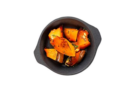 Pan of hot baked pumpkins served with honey isolated at white background.の写真素材