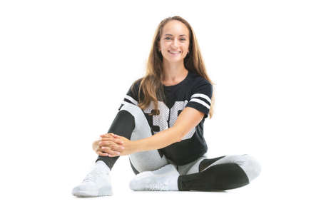 Closeup portrait of happy caucasian woman practicing fitness and smiling isolated at white background.の写真素材