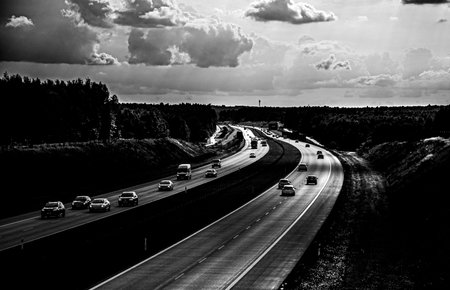 Traffic on the highway in black and white. Black and white photo.の写真素材