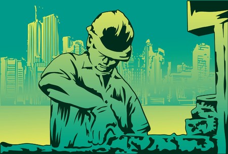 Image of a mason who is working on brick for his construction site.の写真素材