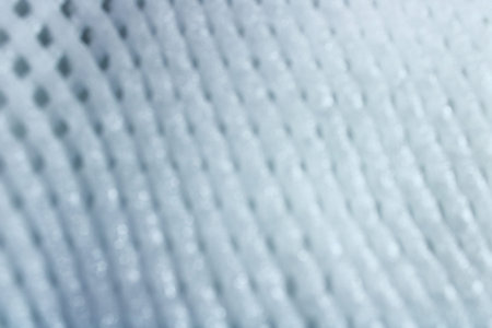 Abstract blurred light grey mesh texture background with soft gradient and subtle depth. Clean modern backdrop for presentations, branding, websites and minimalist design projectsの写真素材