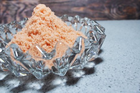Pink Himalayan Salt in Decorative Glass Bowl. Close up of Mineral Sea Salt Crystals for Gourmet...