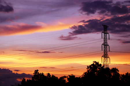 silhouette of electrical pole with sunset skyの写真素材