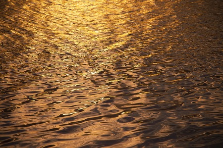 Blurry background of surface water in the sunset timeの写真素材