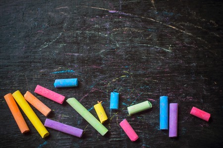 Color chalk on desk backgroundの写真素材