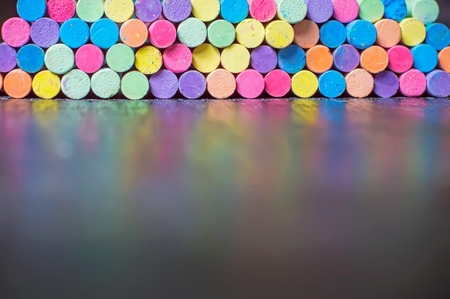 Blurry multicolor chalk on desk for education backgroundの写真素材
