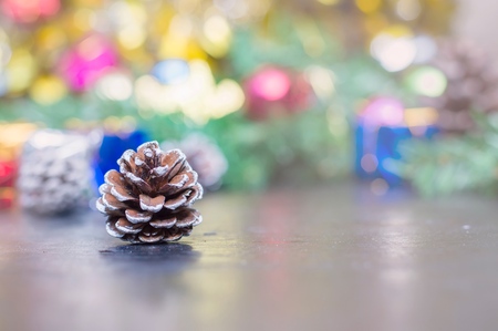 Close up of pinecone on wooden table for Christmas or New Year decoration backgroundの写真素材