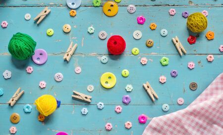 Sewing background. Accessories for needlework on old wooden background.の写真素材