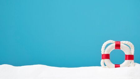 lifebouy on white sand. Copyspace for text. Concept of summerの写真素材