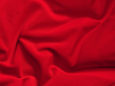 Shape of red fabric. Fabric texture of natural cotton, wool, silk or linen textile material. Red fabric backgroundの写真素材