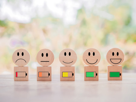 Emotion facce and status of battery charging with emotion face level.の写真素材