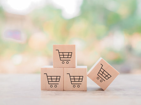 Wooden block with shopping cart icons for online shopping and e-commerce conceptの写真素材