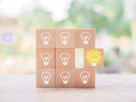Wooden block with light bulb and wooden block with question mark for leadership, creative, idea, innovation concept.の写真素材
