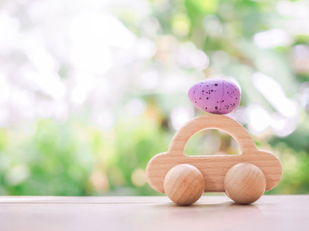 Wooden toy car with Easter eggs for EASTER DAY concept.の写真素材