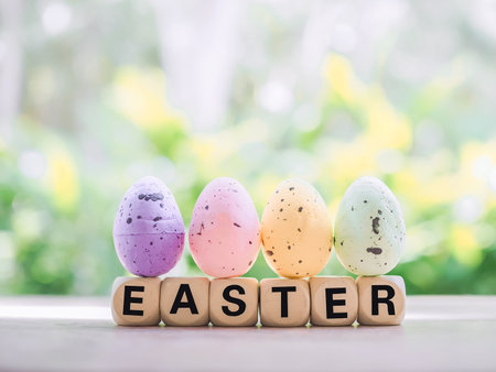 Wooden block with word HAPPY EASTER with colorful eggs for Easter day concept.の写真素材