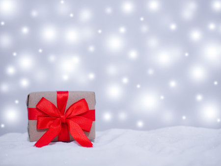 Gift box with shiny light for Christmas and New Year holidays background, Winter season, falling snow, Copy space for Christmas and New Year holidays greeting card.の写真素材