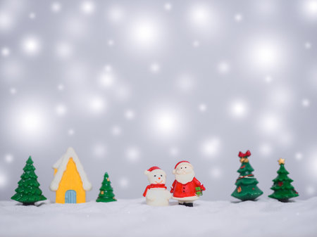 Santa claus and Snowman in the town with shiny light for Christmas and New Year holidays background, Winter season, falling snow, Copy space for Christmas and New Year holidays greeting card.の写真素材